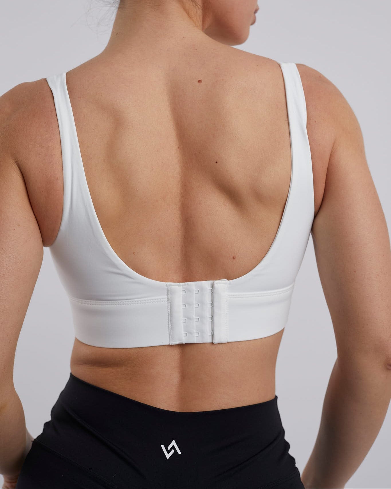 Sujetador deportivo alta sujeción blanco con cierre evilla